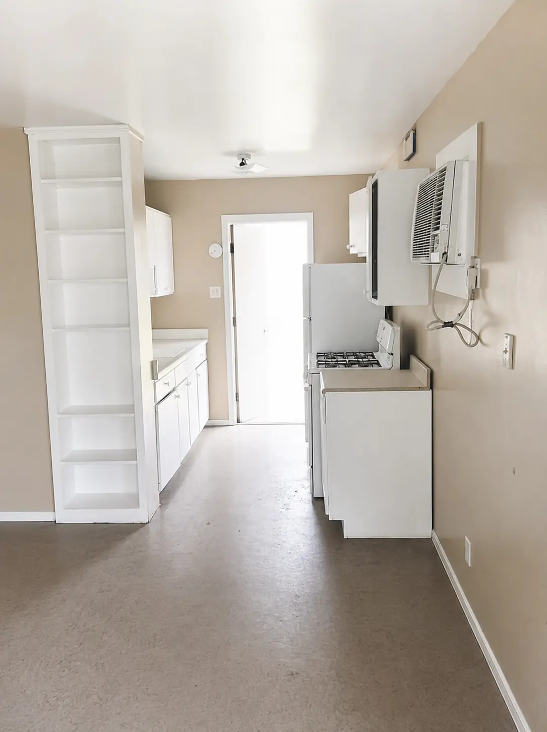 Kitchen — gas range and full-size refrigerator